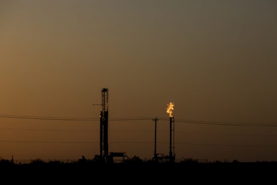 Flames burn bright from a gas flare at an oil and gas production site near Pecos, Texas, U.S., on Saturday, Aug. 31, 2019. Photographer: Bronte Wittpenn/Bloomberg