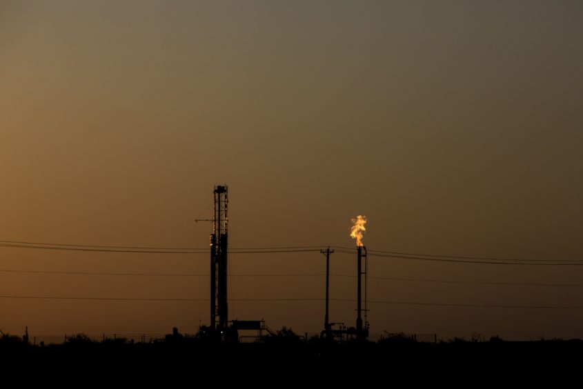 Flames burn bright from a gas flare at an oil and gas production site near Pecos, Texas, U.S., on Saturday, Aug. 31, 2019. Photographer: Bronte Wittpenn/Bloomberg