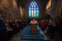 A prayer held in the Kirk of St Nicholas in Aberdeen in 2014, marking the fifth anniversary of the 2009 crash.
Picture by Michal Wachucik/Newsline Media Ltd.