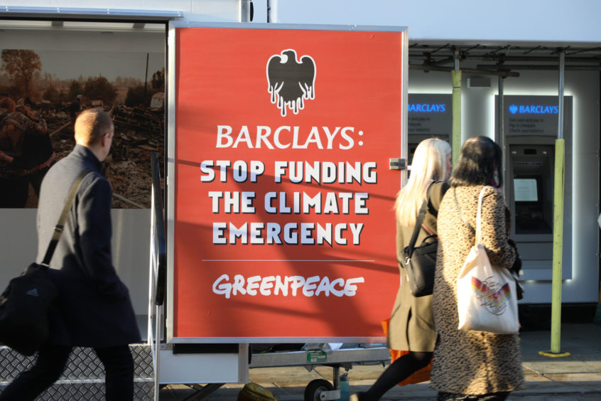 Handout photo issued by Greenpeace of a sign outside a Manchester branch of Barclays bank which they have closed down over the bankÕs support for fossil fuels. PA Photo. Picture date: Monday March 2, 2020. The environmental campaigners targeted almost 100 branches from Portsmouth to Dundee early this morning, shutting them down by disabling doors to prevent staff from entering. They demanding that Barclays stops its support for oil, gas and coal companies and channels funding into renewable energy instead to help tackle the climate crisis. See PA story ENVIRONMENT Barclays. Photo credit should read: Lucy Cartwright/Greenpeace/PA Wire

NOTE TO EDITORS: This handout photo may only be used in for editorial reporting purposes for the contemporaneous illustration of events, things or the people in the image or facts mentioned in the caption. Reuse of the picture may require further permission from the copyright holder.