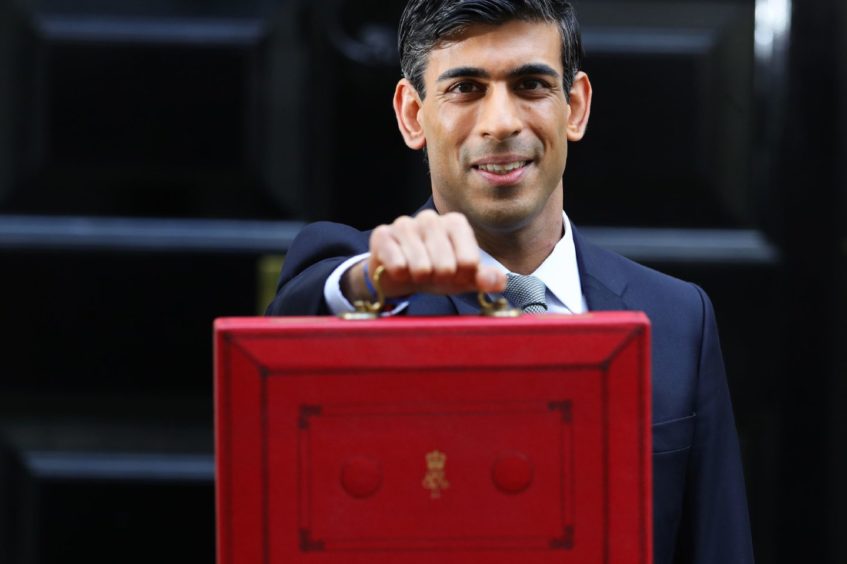 Chancellor Rishi Sunak outside 11 Downing Street, London, before heading to the House of Commons to deliver his Budget. PA Photo.