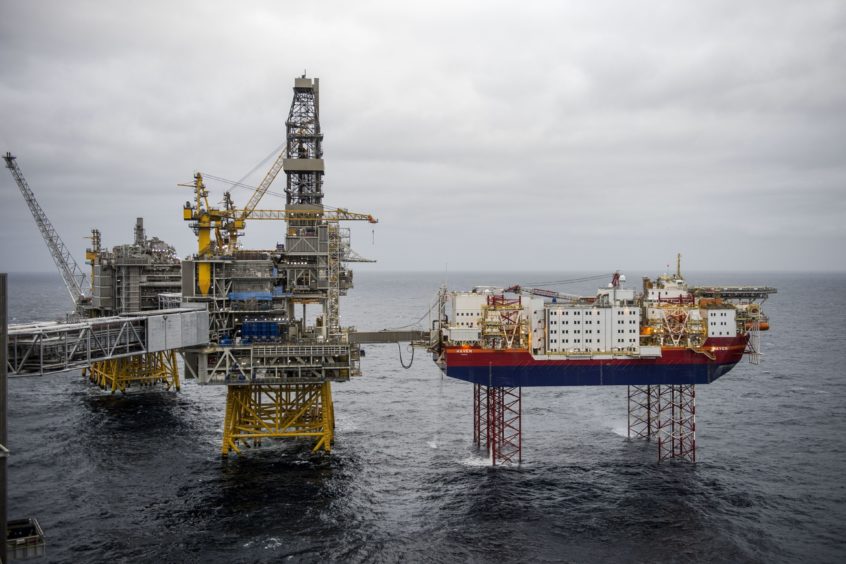 The Haven accommodation jackup rig, owned by Jacktel AS, right, stands connected to the drilling platform, center, on the Johan Sverdrup oil field off the coast of Norway in the North Sea, on Tuesday, Dec. 3, 2019. Sverdrup's earlier-than-expected start in October broke a long trend of underperformance for Norway's overall oil production. Photographer: Carina Johansen/Bloomberg