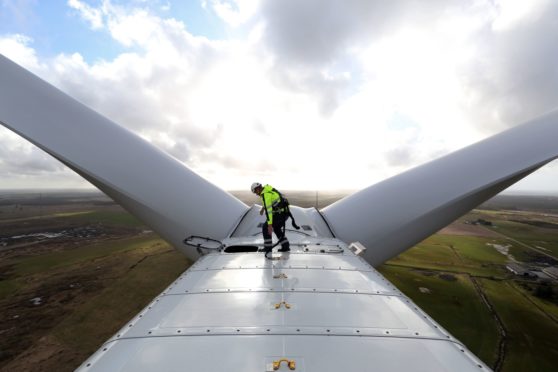 An employee prepares to exit the nacelle of a Vestas A/S V136 wind turbine during operational testing at the Danish National Test Center for Large Wind Turbines in Osterild, Denmark, on Monday, April 18, 2016. Photographer: Chris Ratcliffe/Bloomberg