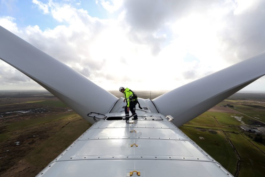 An employee prepares to exit the nacelle of a Vestas A/S V136 wind turbine during operational testing at the Danish National Test Center for Large Wind Turbines in Osterild, Denmark, on Monday, April 18, 2016.  Photographer: Chris Ratcliffe/Bloomberg
