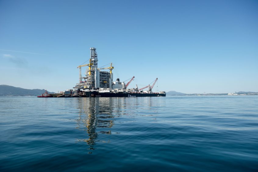 The H-627 barge carrier transports an oil drilling platform onto the world's largest construction vessel, the Pioneering Spirit, in the Bomla fjord near Leirvik, ahead of its transportation to the Johan Sverdrup oil field, Norway.