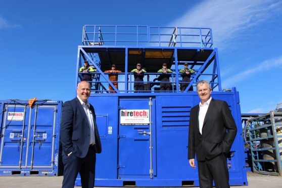 Keith Mackie MD (left) and Andy Buchan CEO (right) with some members of the Hiretech Team