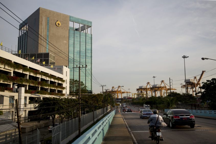 Traffic travels past the PTT Pcl Phrakhanong office in Bangkok, Thailand, on Thursday, Feb. 11, 2016. Photographer: Brent Lewin/Bloomberg