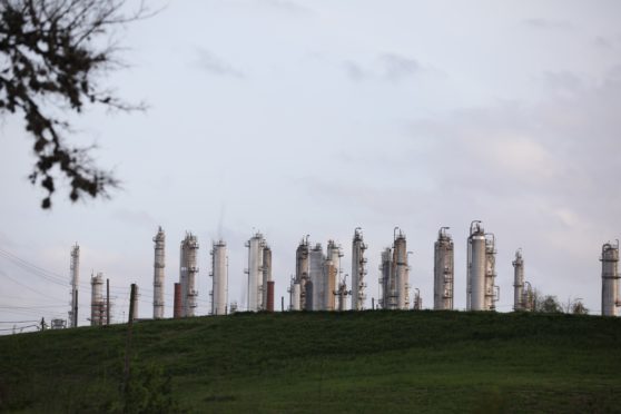 A refinery stands next to Charles H. Milby Park in Houston, Texas, U.S., on Sunday, March 8, 2020. Houston has been purposefully going green for more than a decade. The municipal government gets 92% of all the power it uses in the buildings it owns from wind and solar and has been on the U.S. Environmental Protection Agency's list of the largest renewable power users since 2016. Photographer: Sharon Steinmann/Bloomberg