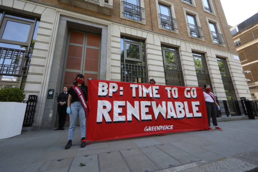 Greenpeace activists stage a socially distanced protest outside BP’s Annual General Meeting, which is being broadcast from their London headquarters. 
Pic: Greenpeace