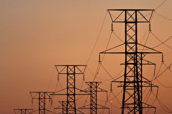 Power transmission lines are suspended from electricity pylons in Kearny, New Jersey. Photographer: Steve Hockstein/Bloomberg