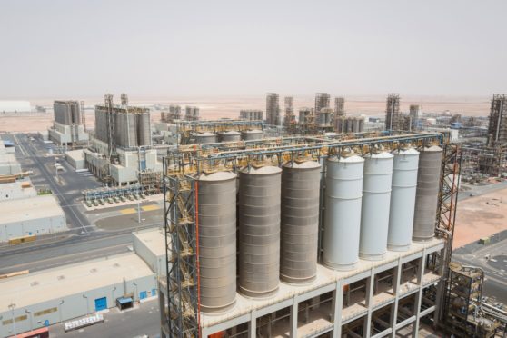 Processing tanks stand at the Ruwais refinery and petrochemical complex, operated by Abu Dhabi National Oil Co. (ADNOC), in Al Ruwais, United Arab Emirates, on Monday, May 14, 2018. Adnoc is seeking to create worlds largest integrated refinery and petrochemical complex at Ruwais. Photographer: Christophe Viseux/Bloomberg