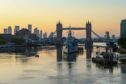 The sun rises beyond Tower Bridge in London, U.K., on Friday, May 29, 2020. For the last 11 weeks, Europe's financial center has been staffed with skeleton crews, particularly on the high-speed trading desks that are difficult to run from home. Photographer: Hollie Adams/Bloomberg