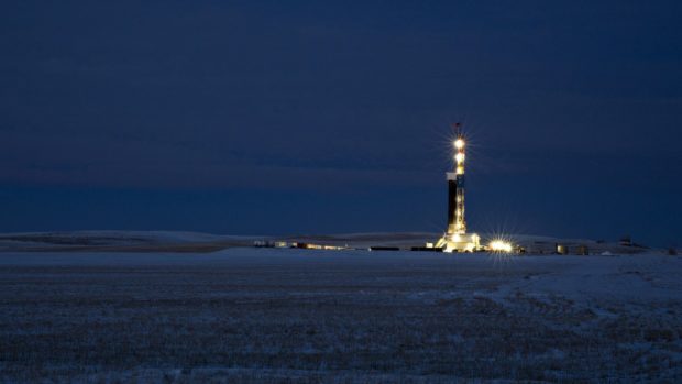 A rig stands at night in the Bakken Formation outside Watford City, North Dakota.