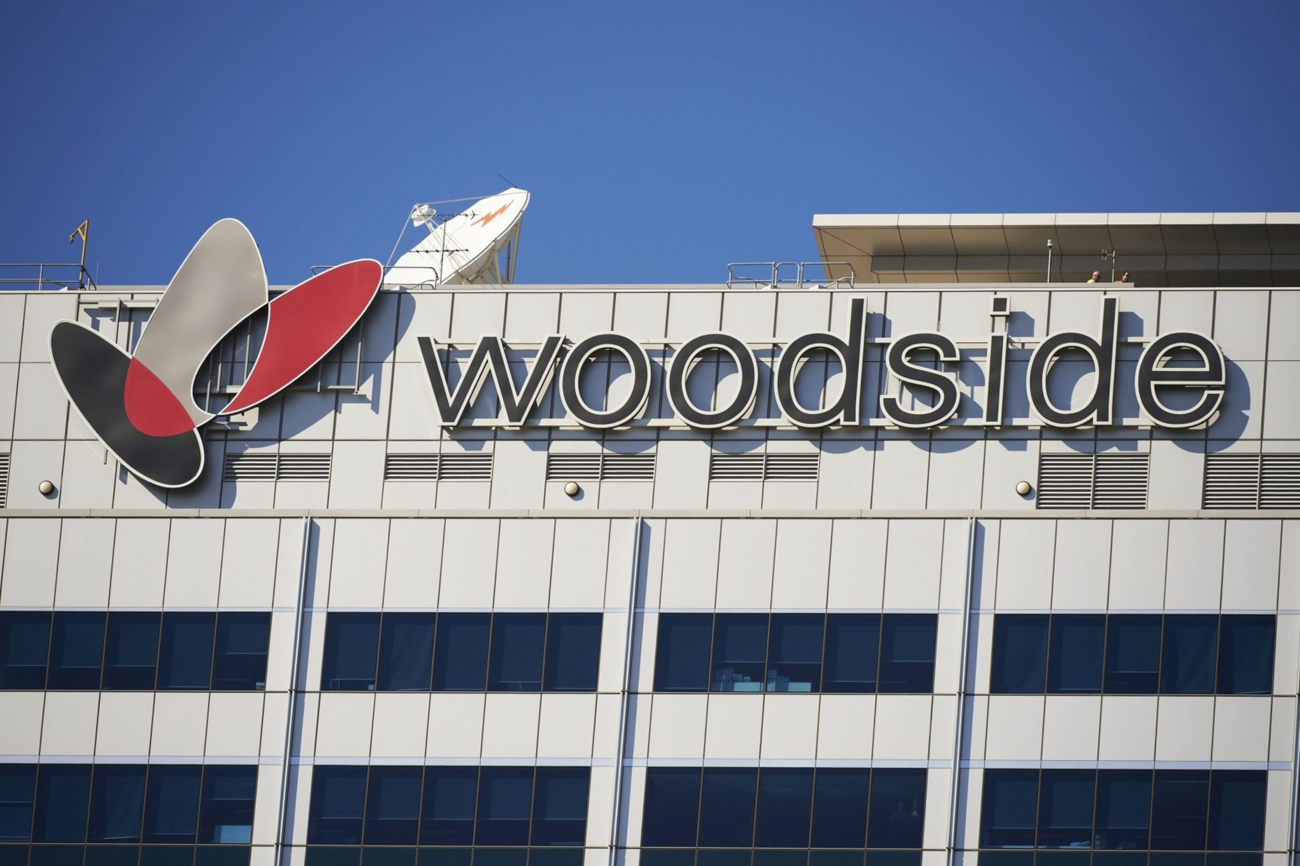 The Woodside Petroleum Ltd. logo is displayed atop the Woodside Plaza building, which houses the company's headquarters, in the central business district of Perth, Australia.