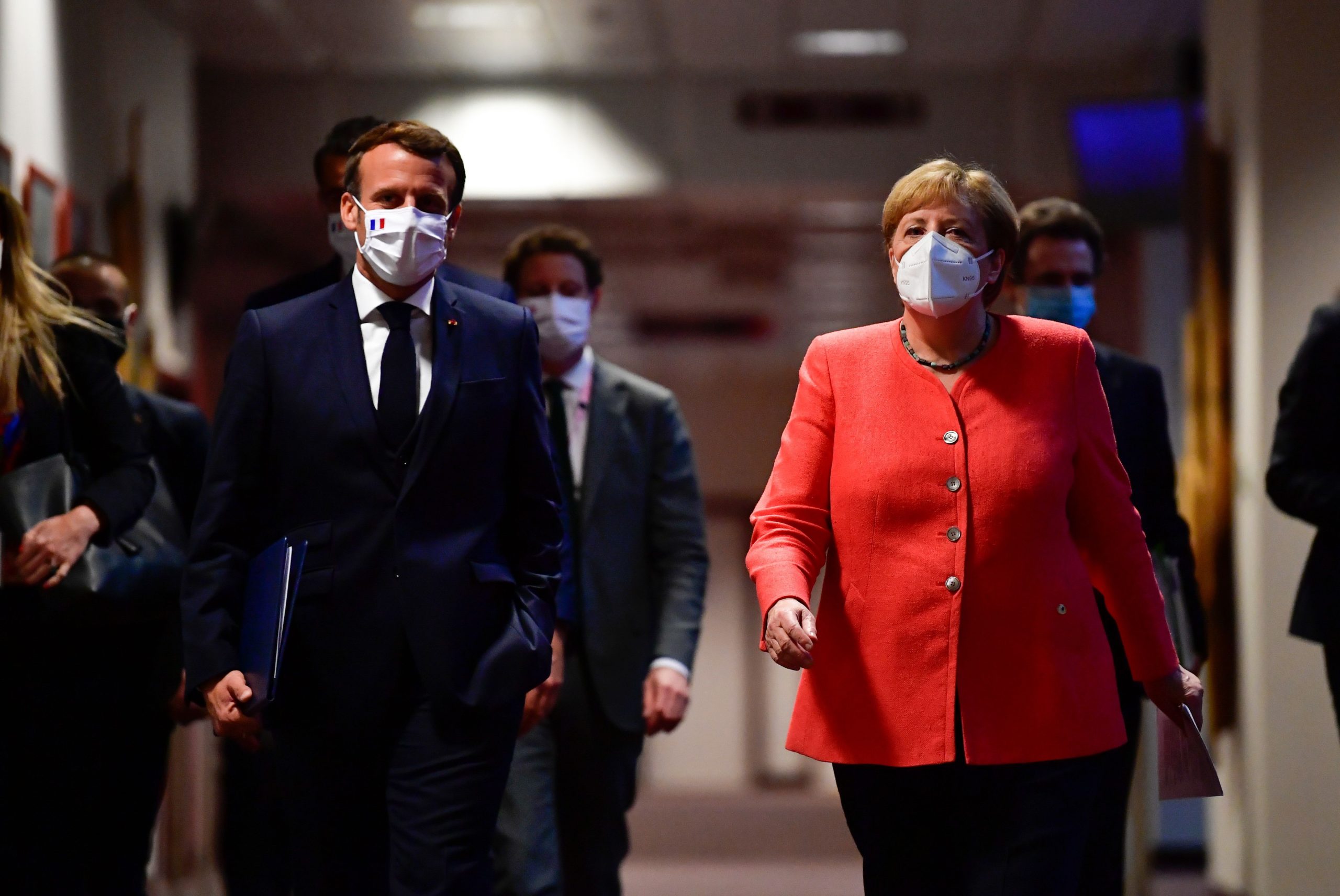 German Chancellor Angela Merkel (R) and French President Emmanuel Macron (L) arrive for a joint press conference at the end of the European summit at the EU headquarters in Brussels on July 21, 2020. Photographer: John Thys/AFP/Getty Images