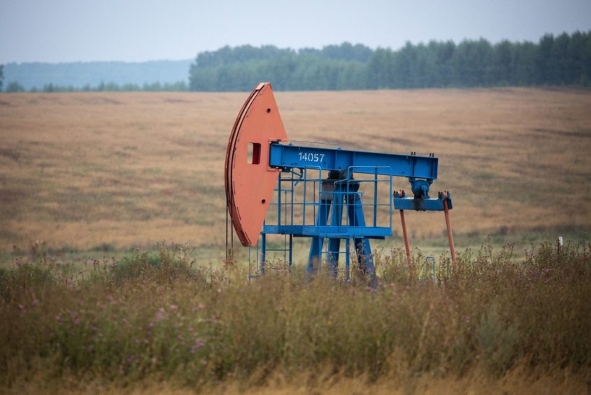 An oil pumping jack, also known as "nodding donkey", operates in an oilfield near Almetyevsk, Russia, on Sunday, Aug. 16, 2020. Oil fell below $42 a barrel in New York at the start of a week that will see OPEC+ gather to assess its supply deal as countries struggle to contain the virus thats hurt economies and fuel demand globally.