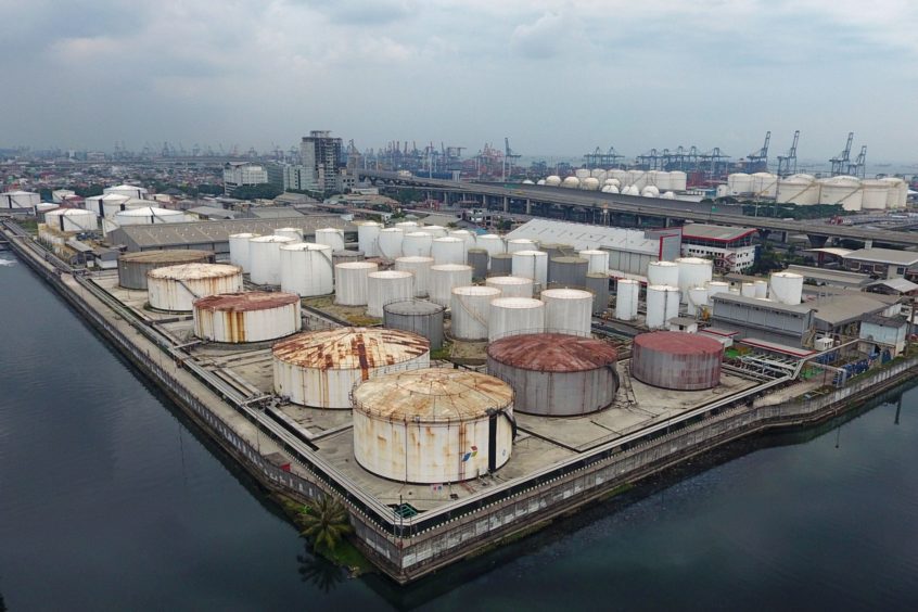 Fuel storage tanks stand at a PT Pertamina facility in this aerial photograph taken above Tanjung Priok Port in Jakarta, Indonesia on Tuesday, April 21, 2020.  Photographer: Dimas Ardian/Bloomberg