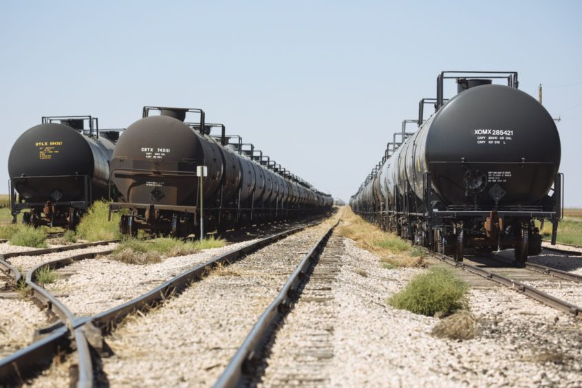 Tanker train cars sit parked near Sunray, Texas, U.S., on Saturday, Sept. 26, 2020. After all the trauma the U.S. oil industry has been through this year -- from production cuts to mass layoffs and a string of bankruptcies -- many producers say theyre still prioritizing output over reducing debt. Photographer: Angus Mordant/Bloomberg