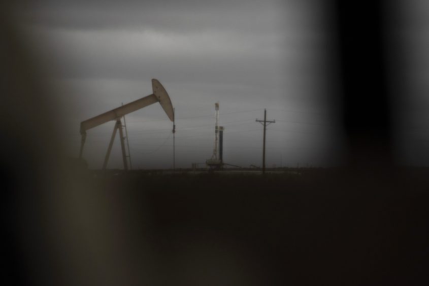 A horizontal drilling rig and a pump jack sit on federal land in Lea County, New Mexico, U.S., on Thursday, Sept. 10, 2020. With the U.S. oil industry reeling from the collapse in demand this year, the New Mexico shale patch has emerged as the go-to spot for drillers desperate to squeeze as much crude from the ground without bleeding cash. Theres just one problem: Joe Biden wants to ban new fracking there.