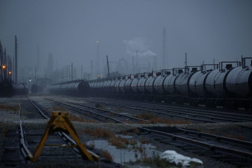 Oil tanker rail cars parked at the Motiva Port Arthur refinery ahead of Hurricane Delta in Port Arthur, Texas, U.S., on Friday, Oct. 9, 2020. Delta churned toward the U.S. Gulf Coast, packing a deadly storm surge and winds strong enough to damage well-built homes as it neared an area of Louisiana still recovering from Hurricane Laura. Photographer: Luke Sharrett/Bloomberg