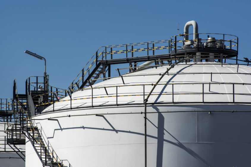 An oil storage tank stands at a facility in the Alrode district of Johannesburg, South Africa, on Tuesday, April 21, 2020. The oil meltdown accelerated, with huge losses sweeping through markets as the world runs out of places to store unwanted crude and grapples with negative pricing. Photographer: Waldo Swiegers/Bloomberg