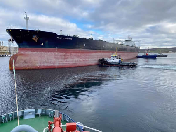 The 333 metre long supertanker ‘Front Endurance’ being assisted onto jetty three in Sullom Voe Harbour. Photo: SIC