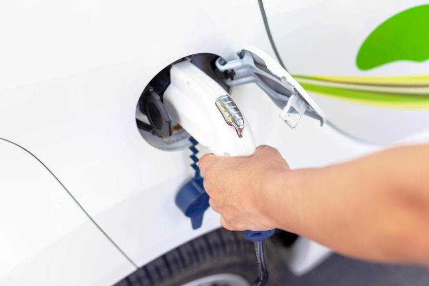 Electric car battery charging at charge station