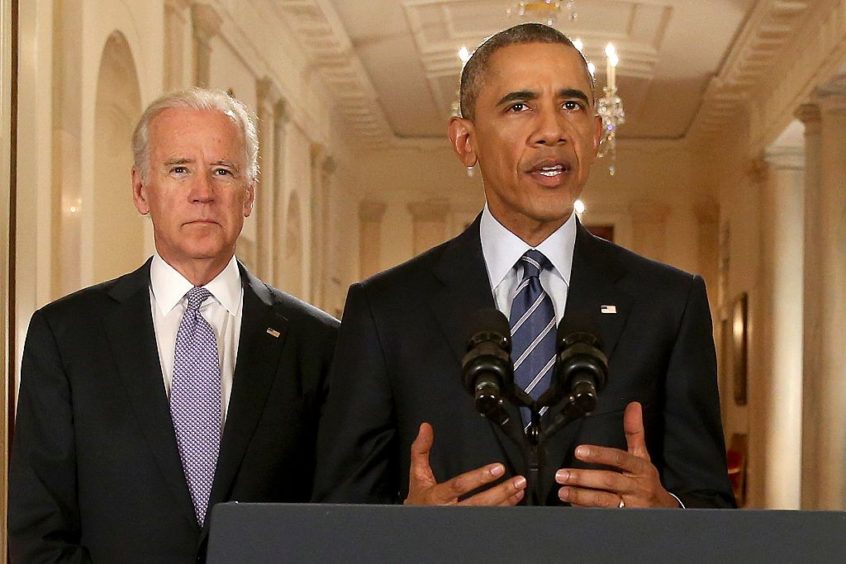 Barack Obama, standing with then-vice president Joe Biden, conducts a press conference in the East Room of the White House in response to the Iran Nuclear Deal, on July 14, 2015 in Washington, DC.