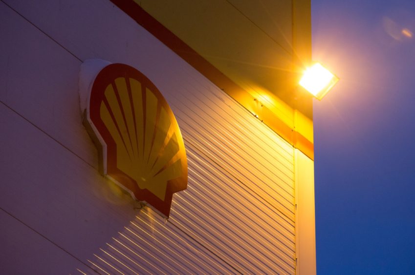 Shell logo illuminated by street light