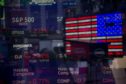 Monitors displaying stock market information are seen through the window of the Nasdaq MarketSite in the Times Square neighborhood of New York, U.S., on Thursday, March 19, 2020.  Photographer: Michael Nagle/Bloomberg