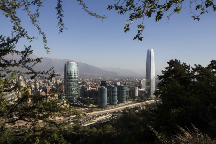 Buildings stand in the skyline of downtown Santiago, Chile, on Wednesday, Dec. 3, 2014.  Photographer: Ronald Patrick/Bloomberg