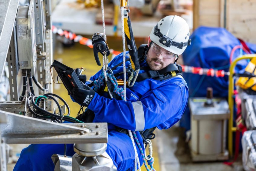 An offshore worker carrying out inspection duties.