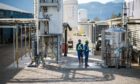 Technicians inspect the directair capture system at the Carbon Engineering Ltd. pilot facility in Squamish, British Columbia. Photographer: James MacDonald/Bloomberg