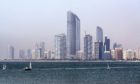 The Landmark skyscraper, center, stands on the city skyline beside a waterway in Abu Dhabi, United Arab Emirates, on Monday, May 30, 2016. Photographer: Alex Atack/Bloomberg