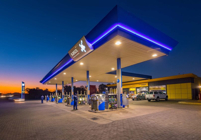 A petrol station lit up at night