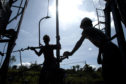 On the job: oil workers in Indonesia