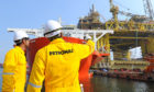 On the job: Petronas workers