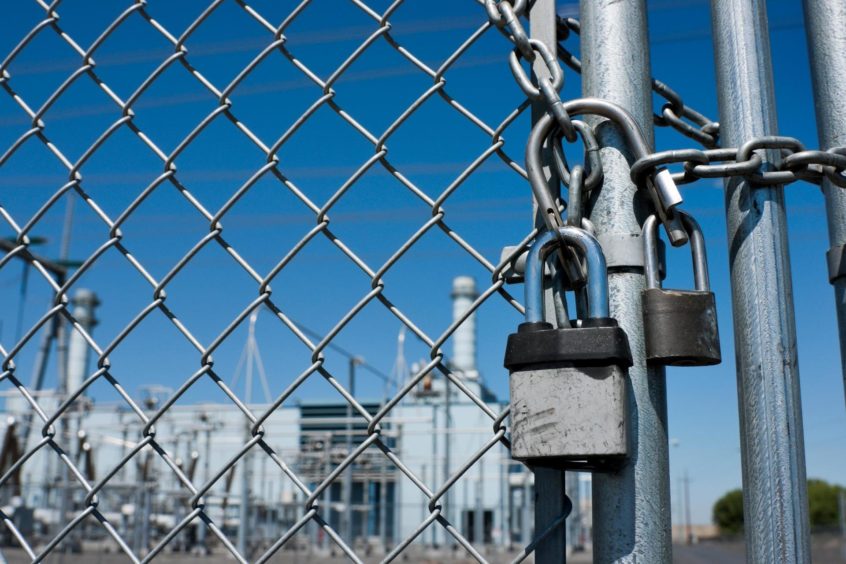 Gas Power Plant Behind Fence and Locked Gate; Shutterstock ID 1694681248; Purchase Order: EV supplement; Job: Winchester column; c8891653-4f95-4b83-ad88-6c82428ca59e