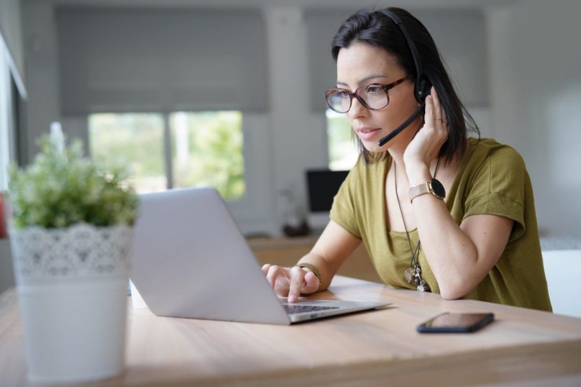 A woman using her laptop.