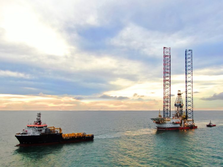 A drilling rig being towed offshore Sarawak, Malaysia