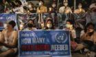 Demonstrators hold up banners during a protest outside the United Nations Building in Bangkok, Thailand, on Thursday, March 4, 2021.
Photographer: Andre Malerba/Bloomberg