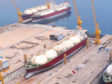LNG carrier in dock, with crane