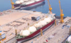LNG carrier in dock, with crane