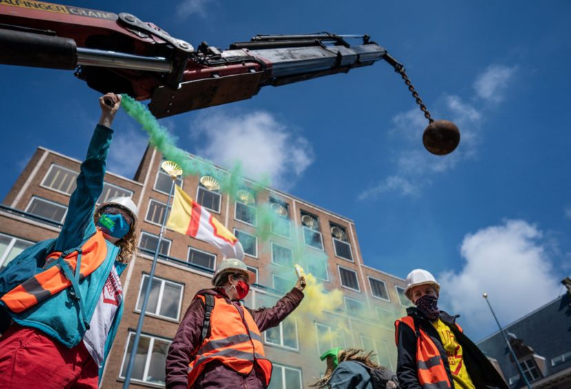 Campaigners demonstrate at Shell's head office in the Hauge during the annual shareholders meeting.
Photo by Hollandse Hoogte/Shutterstock