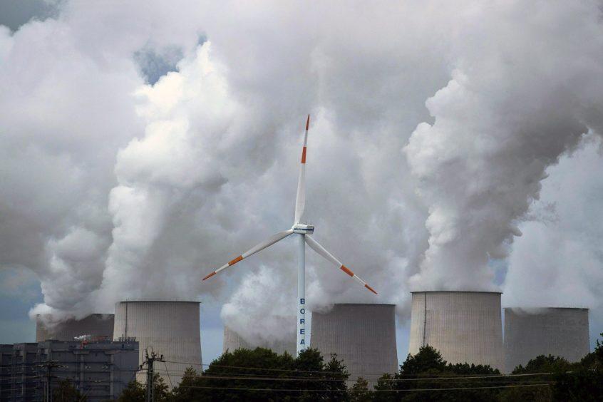 smoke rises from industrial chimnies