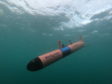 An AUV angles downwards into the water