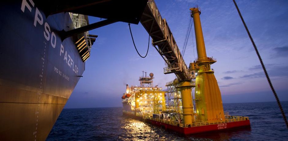 A ship and an FPSO at night in the sea