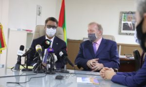 Mauritania and CWP officials sit at a table, with microphones