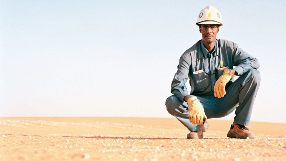 A man with a hard hat in the desert