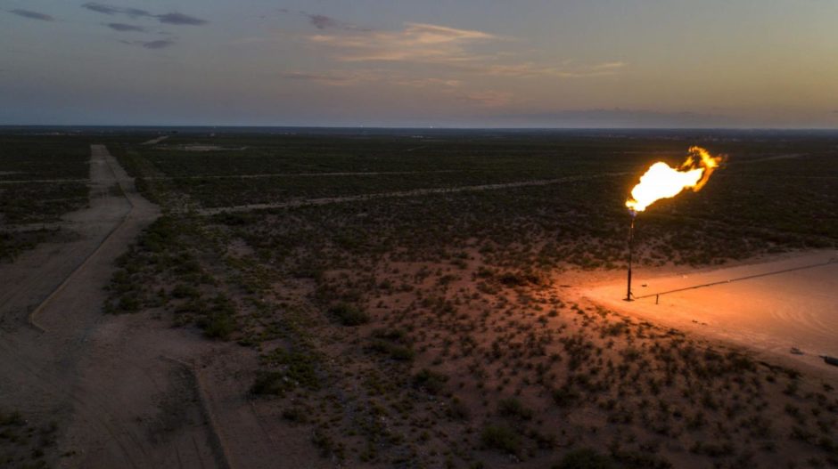 A gas flare is seen at dusk in this aerial photograph taken above a field near Mentone, Texas, U.S., on Saturday, Aug. 31, 2019.  Photographer: Bronte Wittpenn/Bloomberg